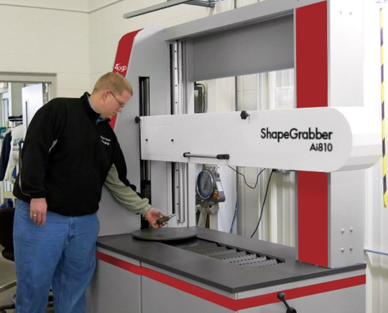 A metrology engineer using a ShapeGrabber laser scanning system at Quad State Gauging and Measurement, Inc.